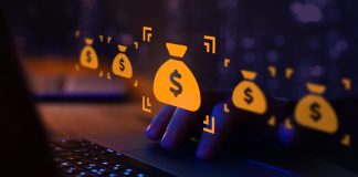 Ministério da Fazenda justifica variação nos valores arrecadados com apostas Símbolo do dólar dentro de um saco virtual na frente da tela do computador