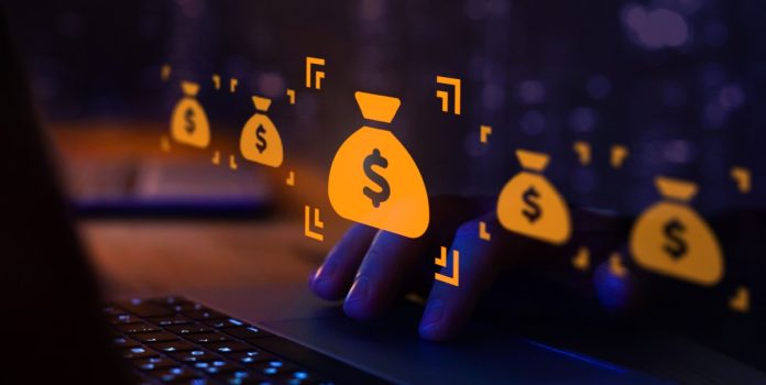 Símbolo do dólar dentro de um saco virtual na frente da tela do computador