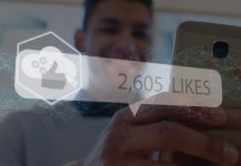Reações das mídias sociais sobre as mãos de um homem usando o smartphone