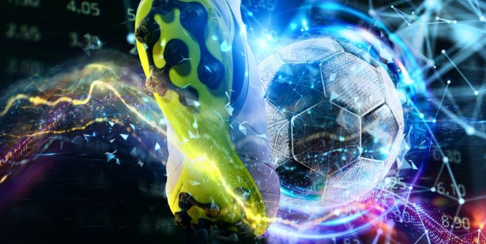 betcris-entrevista-sbc-summit-spotlight- Simulação de um chute com chuteira e bola de futebol