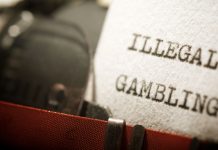 Deputado do PT quer responsabilizar bancos e fintechs por tributos de apostas ilegais Papel escrito 'Ilegal Gambling'