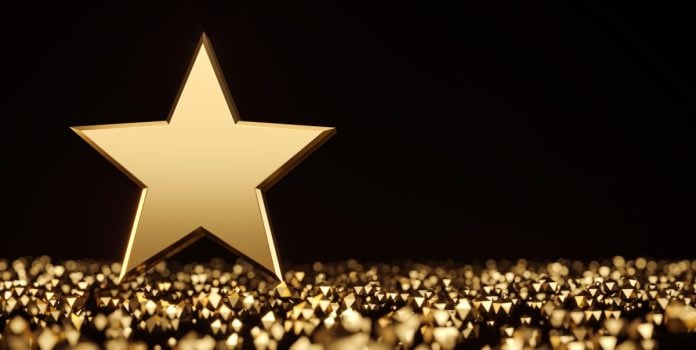 estrelabet-nova-campanha-embaixador-rebranding Estrela dourada com fundo preto