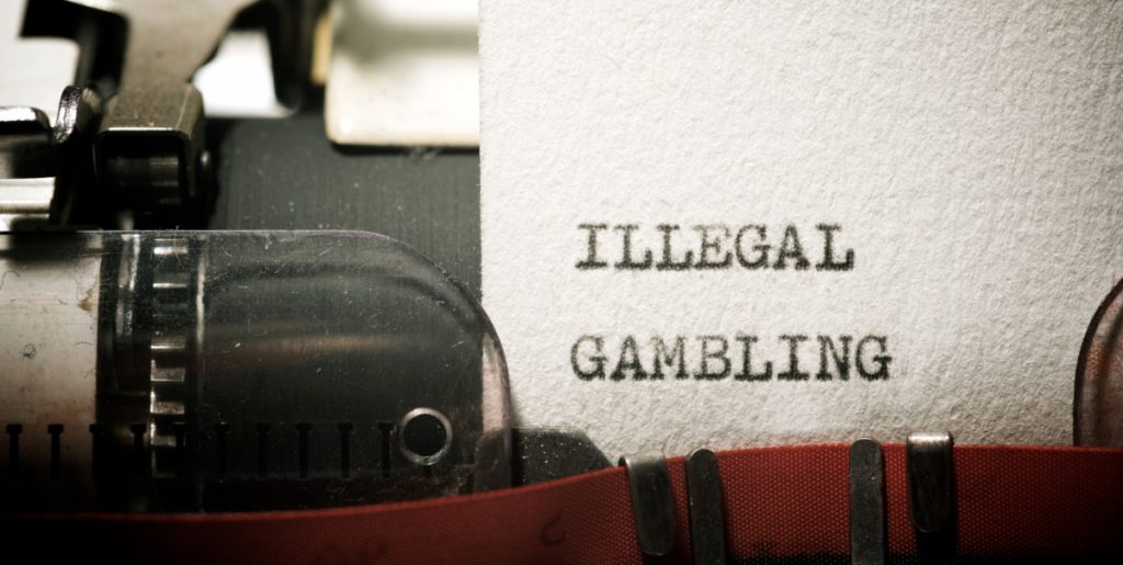 Folha de papel datilografado com a frase “illegal gambling”