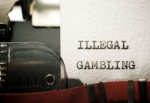 Alta carga tributária fortalece apostas ilegais: especialistas analisam estudo da PwC Folha de papel datilografado com a frase “illegal gambling”