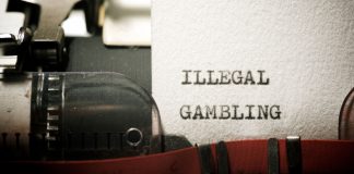 Alta carga tributária fortalece apostas ilegais: especialistas analisam estudo da PwC Folha de papel datilografado com a frase “illegal gambling”