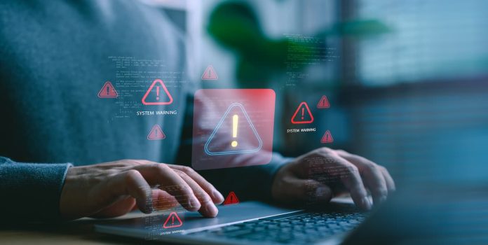 Computador emitindo sinal de alerta.