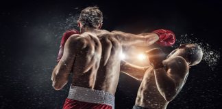 Betsul patrocinará o Fight Music Show 8 Dois lutadores de boxe lutando.