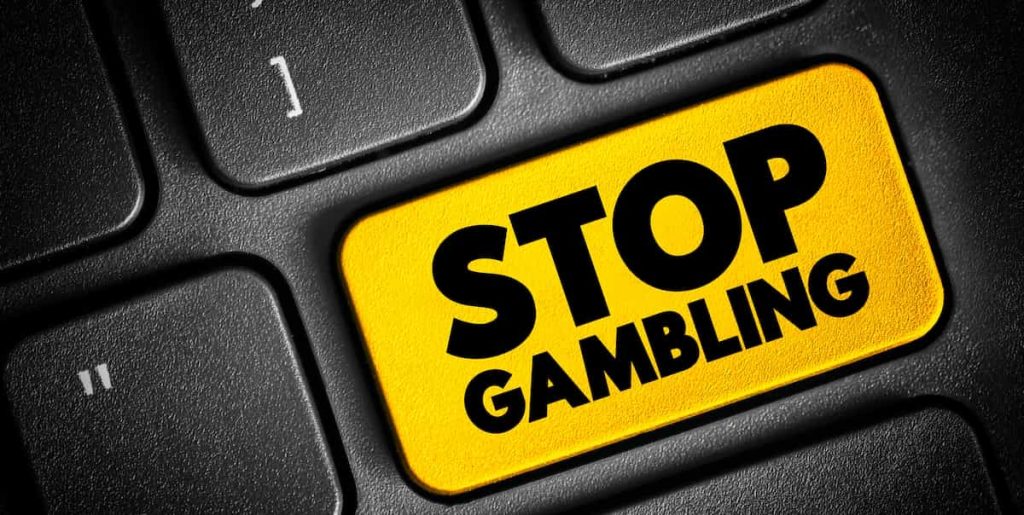 Botão escrito "stop gambling", que em português significa pare de fazer apostas.