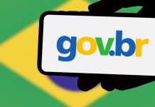 Governo lança campanha contra mercado preditivo Uma mão segurando um smartphone com o logo do governo e a bandeira do brasil no fundo