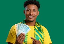 Aposta Legal aponta contribuição de R$ 1.400 por jogador às receitas das operadoras em 2025 Homem segurando cédulas de Real com as cores do Brasil em destaque