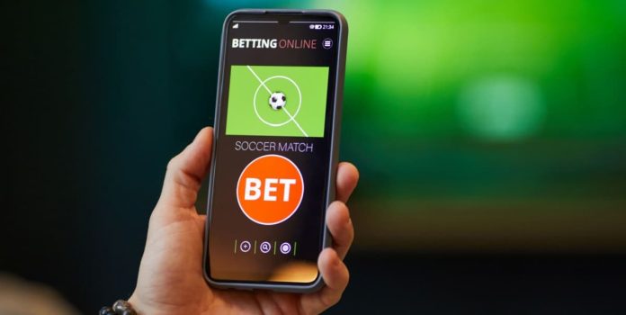 Celular exibindo aplicativo de apostas esportivas.
