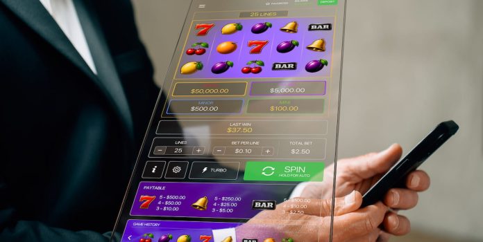 Daniel-Fortune-Alerta-Para-Falsa-Promessa-de-Lucro-em-Caca-Niqueis-Slots Pessoa jogando em um caça-níquel virtual.