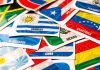 PopOK Gaming fala sobre parceria com Ronaldinho, simplicidade no design de slots e ambições na América Latina Várias bandeiras de países latino-americanos.