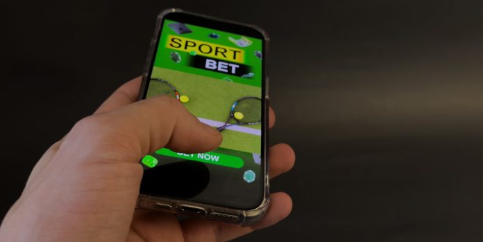 Apostas esportivas feitas em um celular.