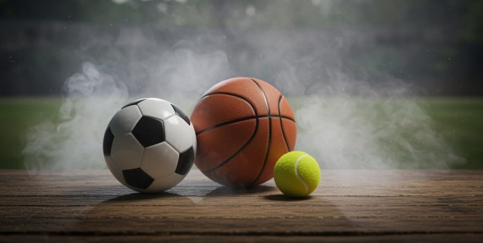 olho-na-bet-expande-cobertura-para-tenis-e-basquete Bolas de baquete, tênis e futebol em um fundo com fumaça, feita com IA