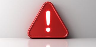 Símbolo vermelho de alerta em fundo branco
